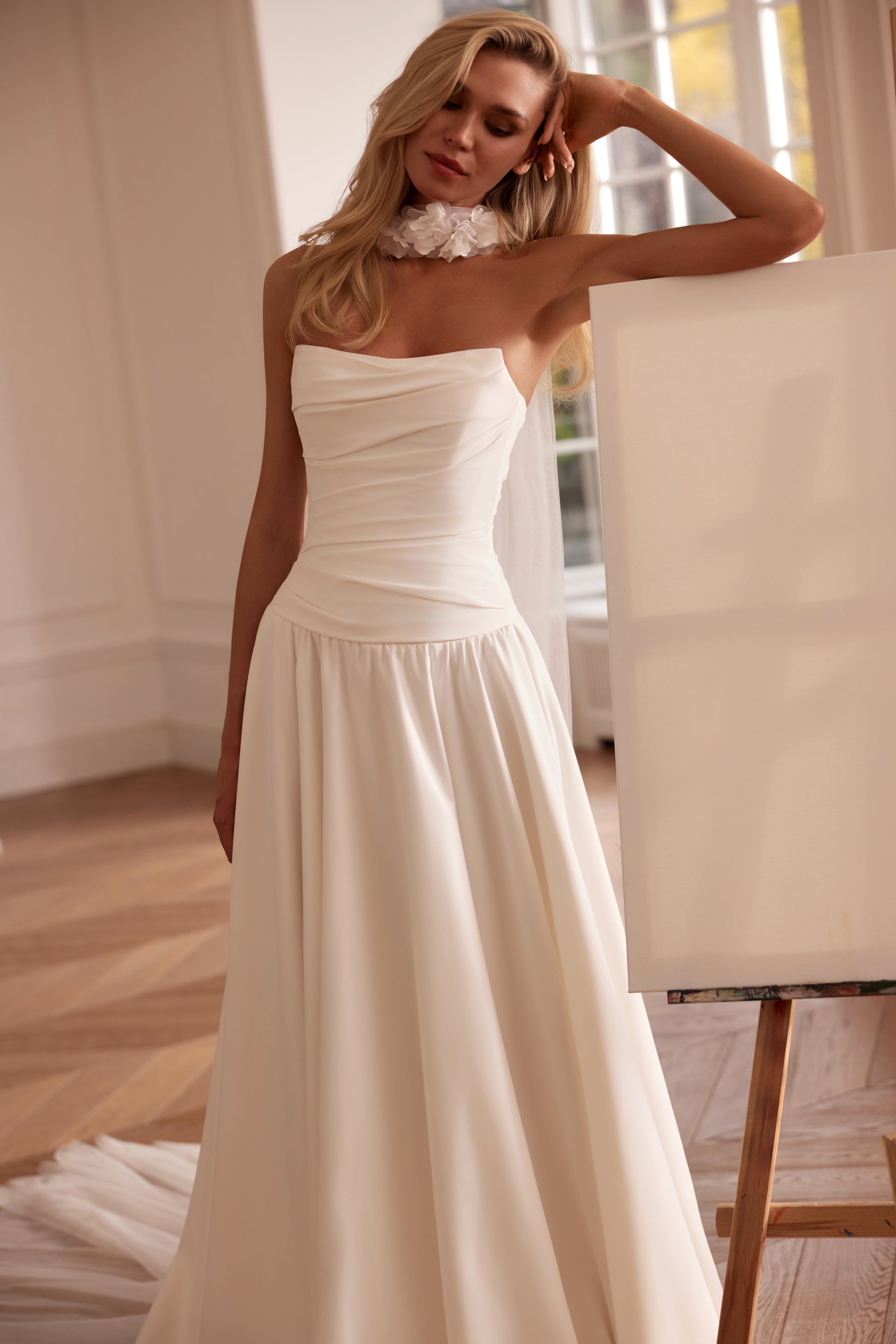 Luxury off-shoulder A-line matte satin wedding dress with floral sleeves, detachable train, and draped bodice — modern romantic bridal gown.