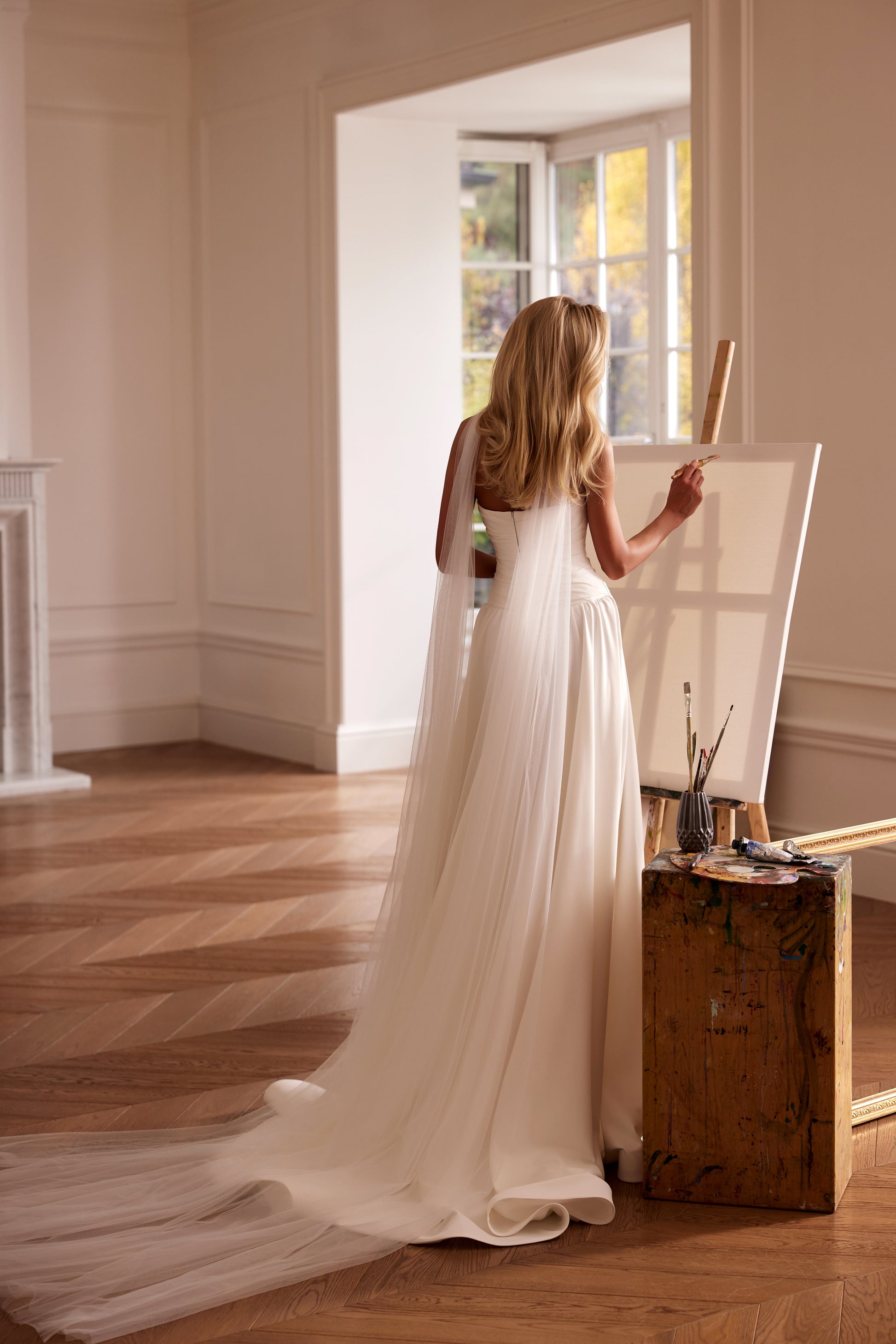 Luxury off-shoulder A-line matte satin wedding dress with floral sleeves, detachable train, and draped bodice — modern romantic bridal gown.