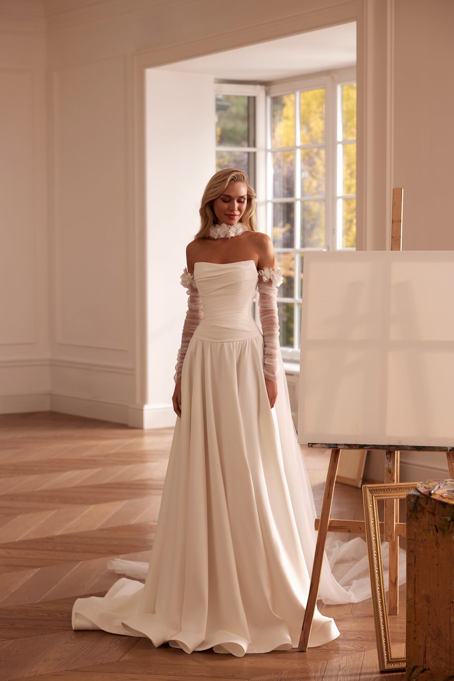 Luxury off-shoulder A-line matte satin wedding dress with floral sleeves, detachable train, and draped bodice — modern romantic bridal gown.