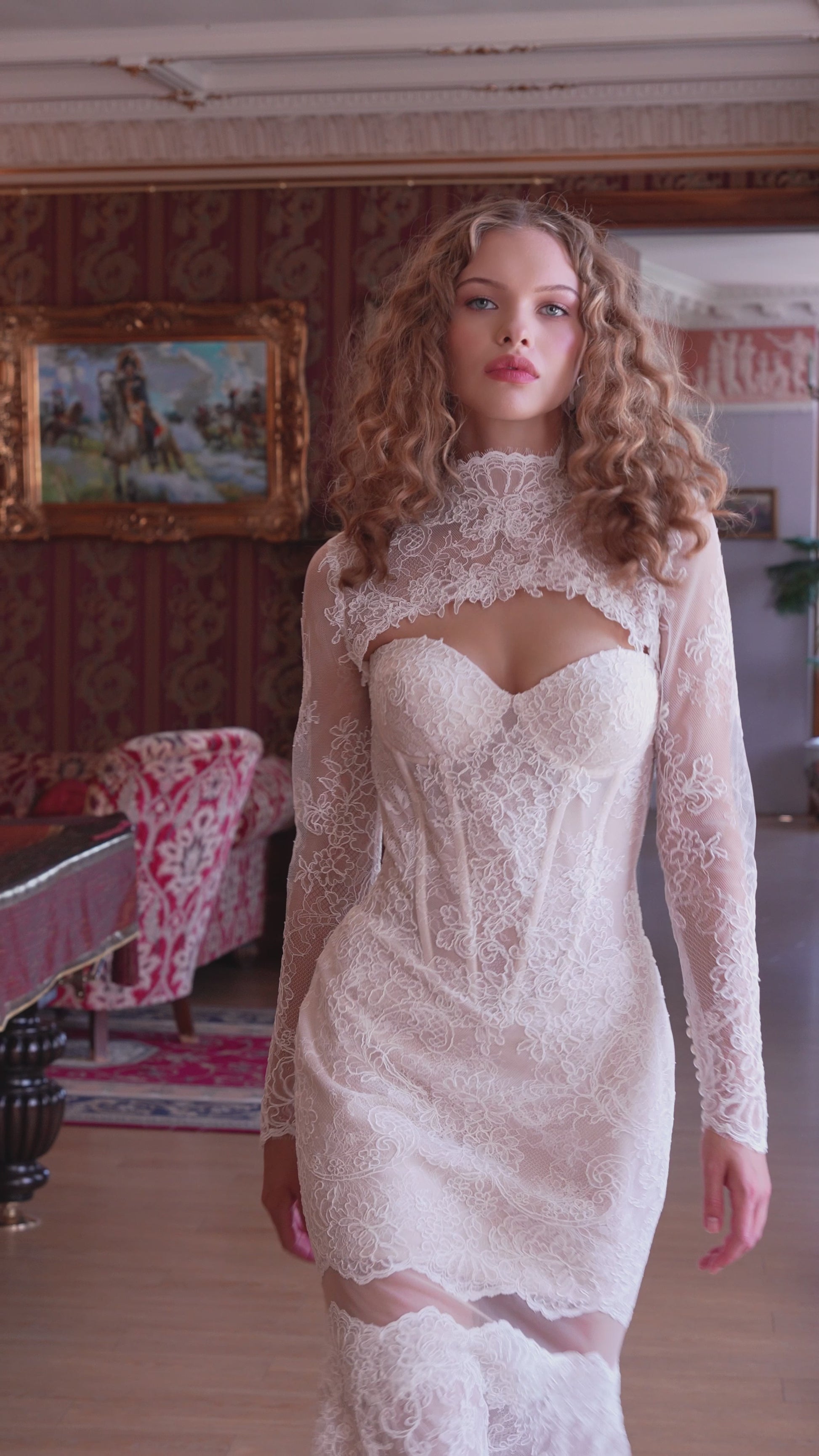 Bride wearing lace mermaid wedding gown with removable long-sleeve bolero