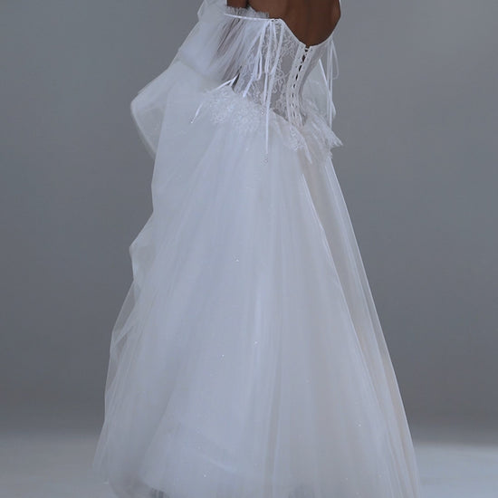 Lace and tulle ball gown wedding dress with corset bodice and peplum waist – video
