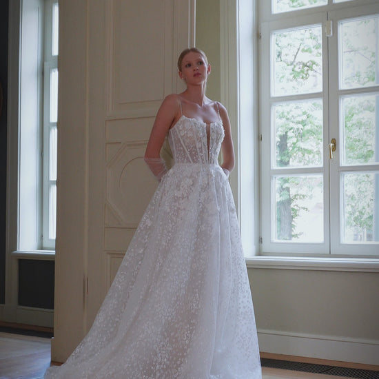 Romantic A-line wedding dress with a lightweight design, court train, and intricate lace details