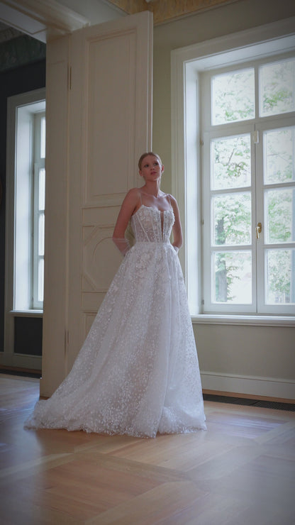 Romantic A-line wedding dress with lace and court train