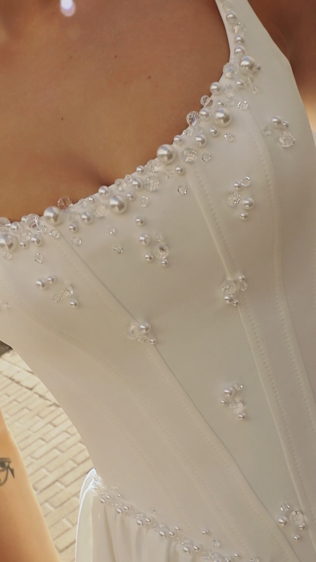 Sleeveless A-line Mikado bridal gown with wide straps, drop-down waist, zip closure, and chapel train. Classic wedding dress in timeless modern style.