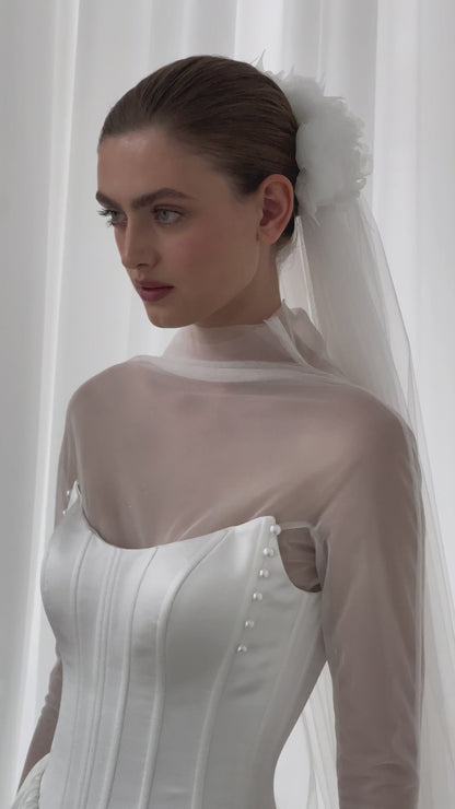 A-line wedding dress with boat neckline and corset back.