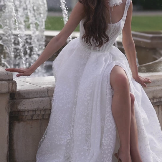 A-line wedding dress with boat neckline and scoop open back.
