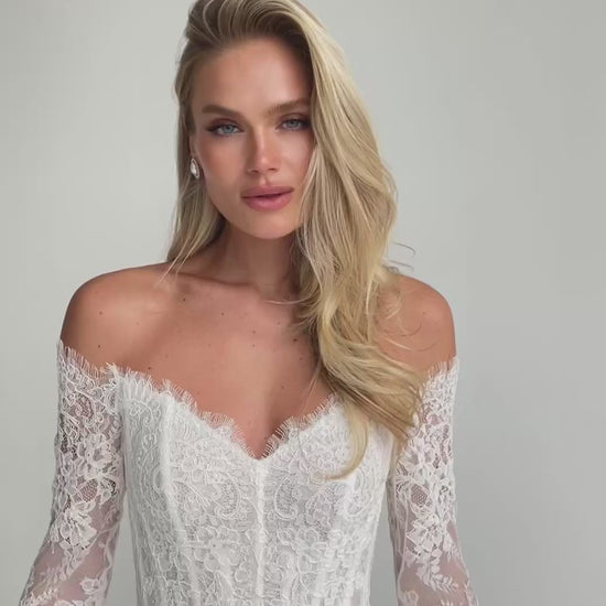 Video: close-up of an off-shoulder sweetheart lace corset with long lace sleeves
