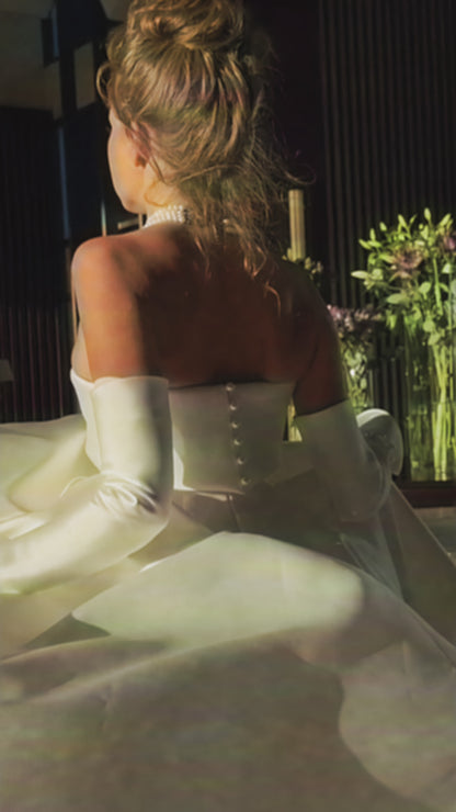 Princess A-line wedding dress with pearl slit sleeves.