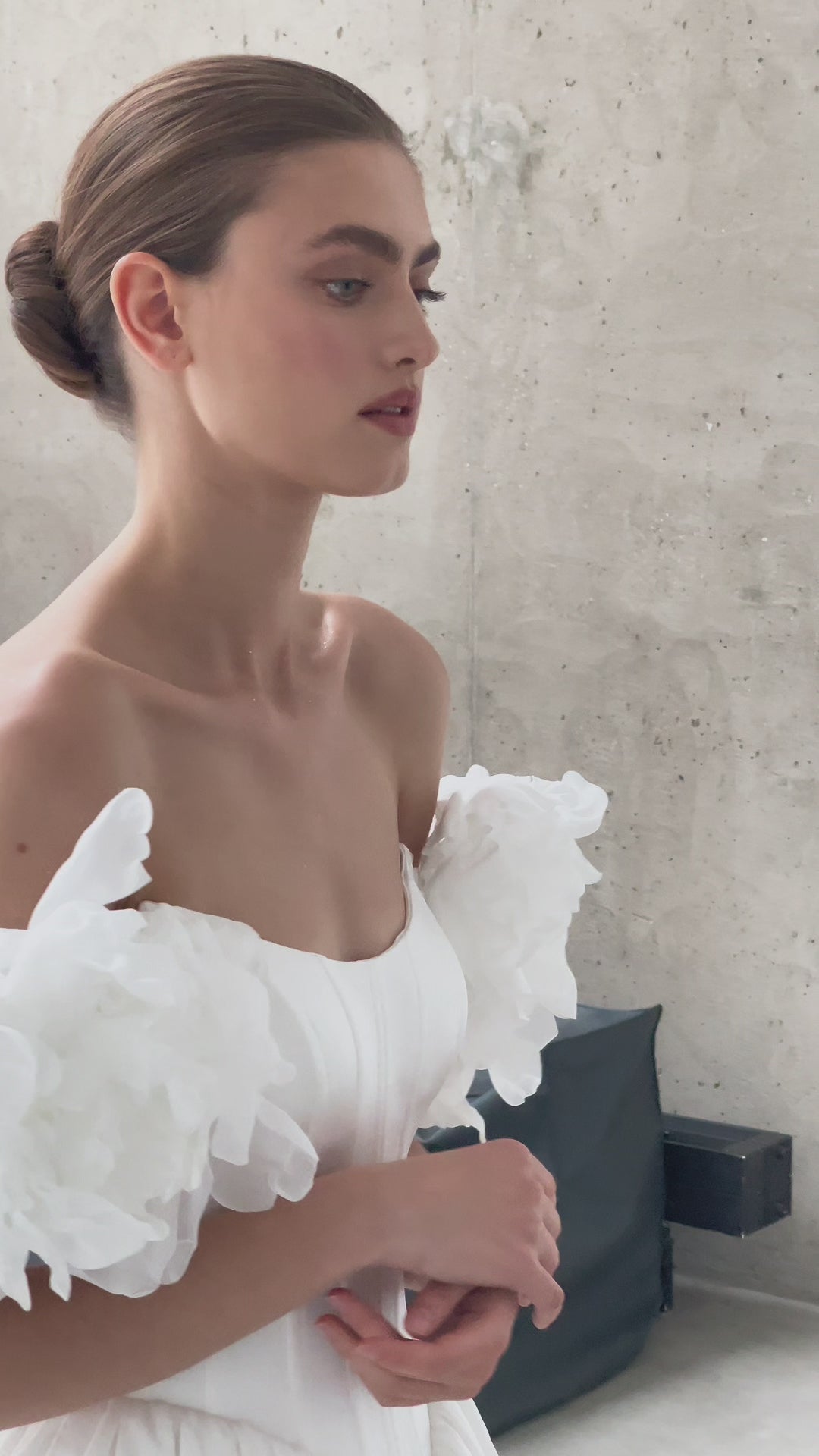 A-line corset wedding dress with boat neckline and sleeves