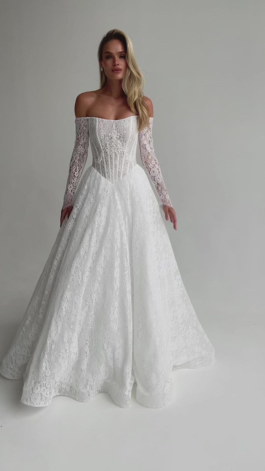 Video: full-length lace A-line wedding dress with an off-shoulder neckline