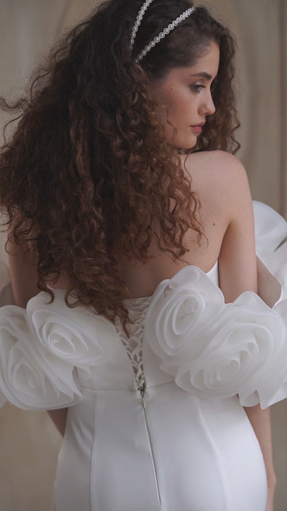 Minimalist mermaid wedding dress with boat neckline and sweep train