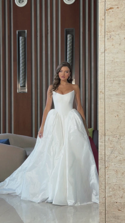 Princess wedding dress with chapel train and boat neckline.
