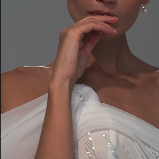 Lace mermaid wedding dress with asymmetric off-shoulder drape – video