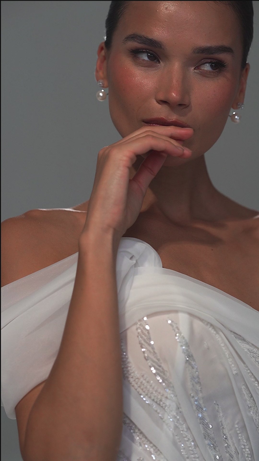 Lace mermaid wedding dress with asymmetric off-shoulder drape – video