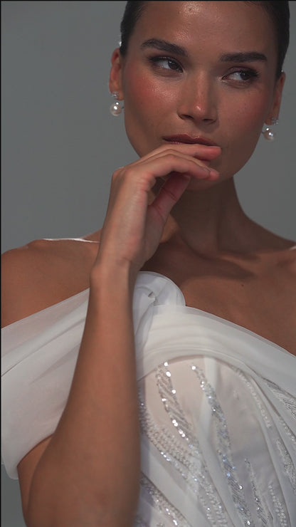 Lace mermaid wedding dress with asymmetric off-shoulder drape – video