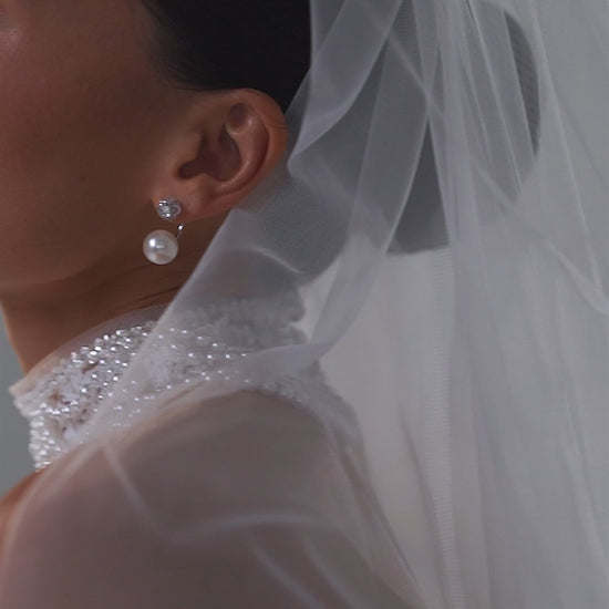 Lace mini wedding dress with corset bodice, sweetheart neckline and detachable tulle train – video