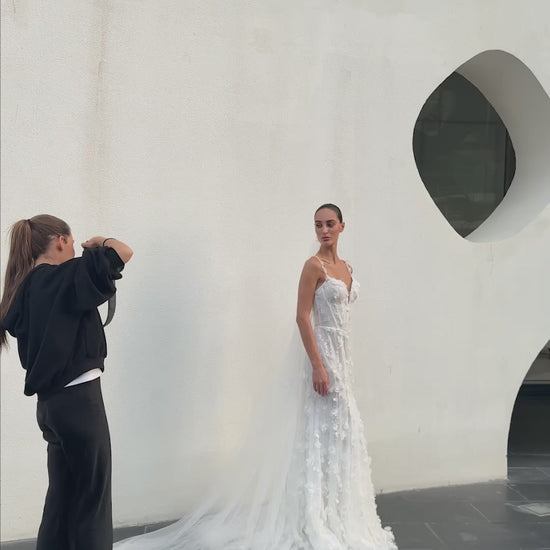 Bride wearing the Capri lace and tulle mermaid wedding gown from the Celeste Collection.