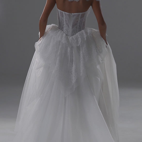 Tulle wedding dress with lace corset bodice, peplum frill and high-neck bolero – video