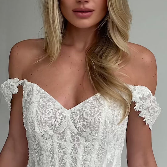 Video: close-up of an off-shoulder beaded lace sweetheart bodice