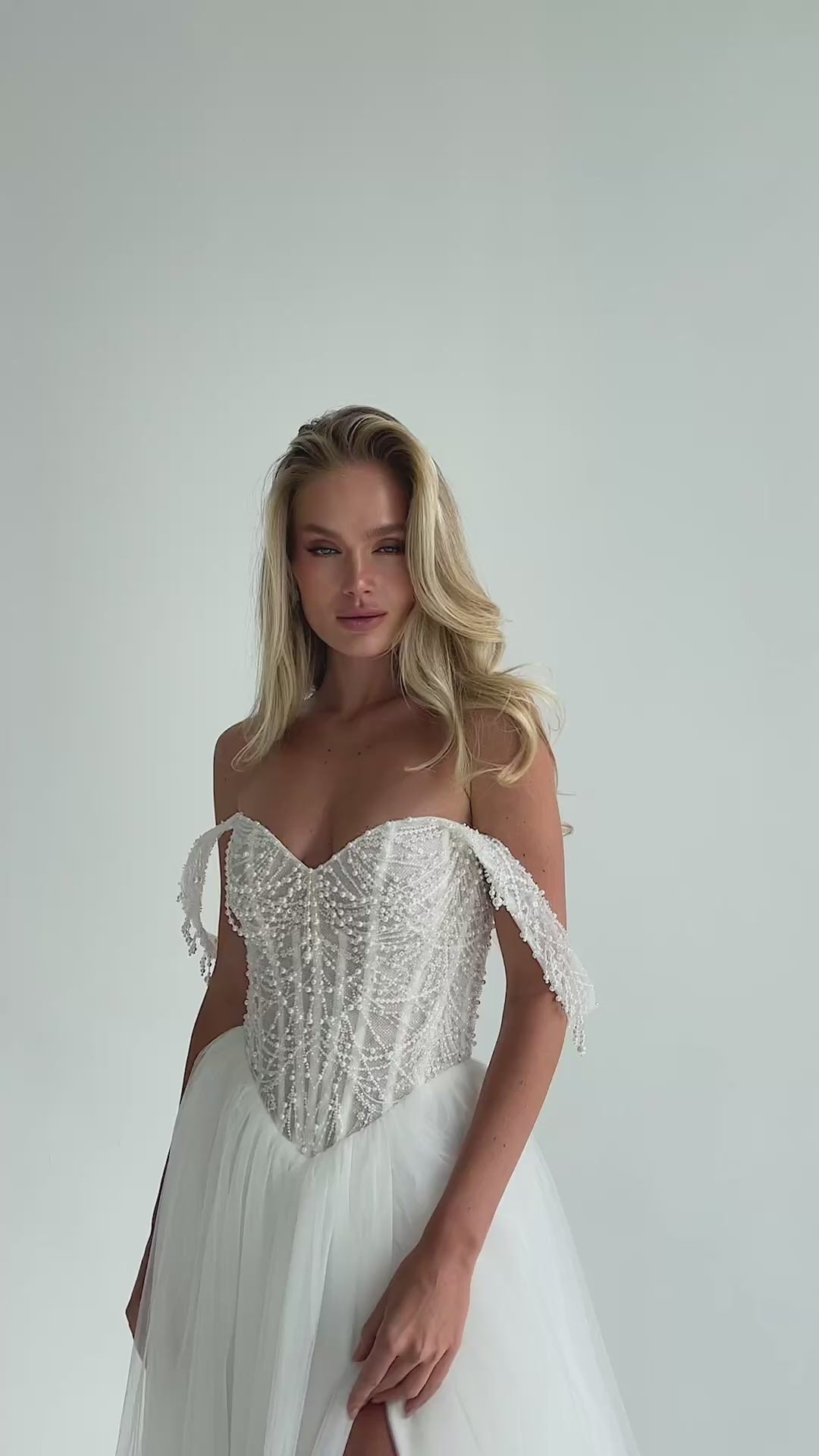 Video: beaded corset bodice with draped straps, portrait
