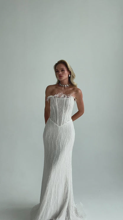 Video: full-length sequin lace mermaid wedding dress with feather trim