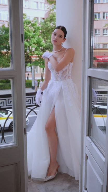 A-line wedding dress with spaghetti straps and boat neckline