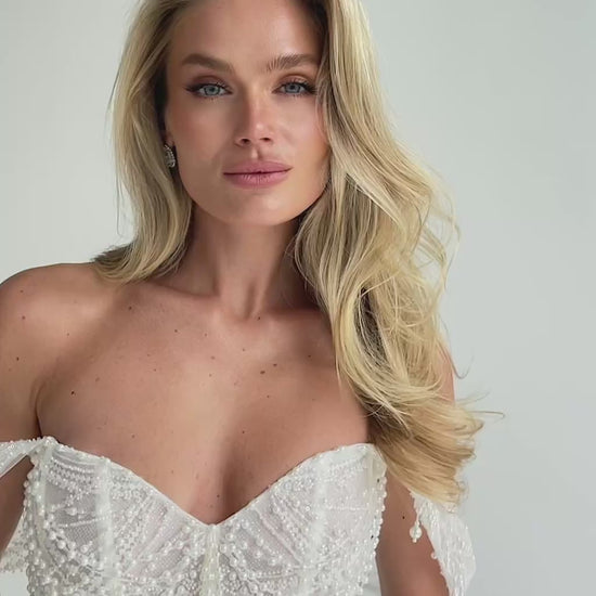 Video: close-up of a beaded sweetheart corset with draped straps