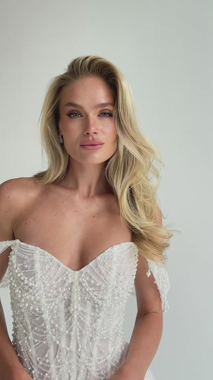Video: close-up of a beaded sweetheart corset with draped straps
