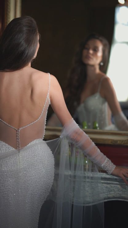 Mermaid fitted wedding dress with backless design and sweep train