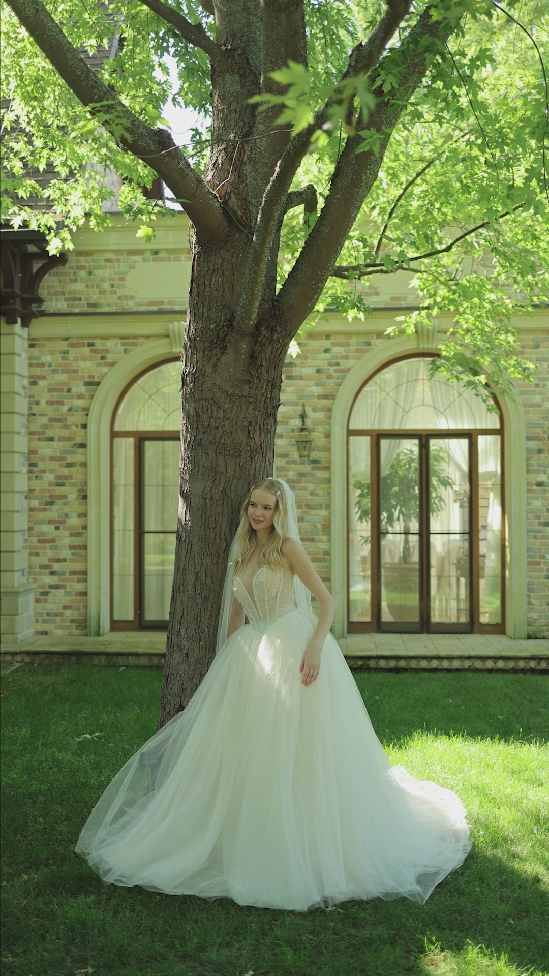 Princess wedding dress with pearl details and chapel train