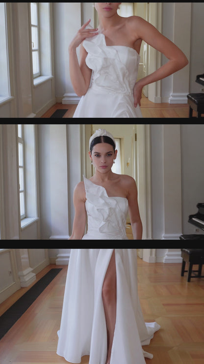 Strapless modest wedding dress with lace-up back and slit.