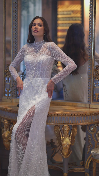 Sheath wedding dress with beaded lace and keyhole open back.
