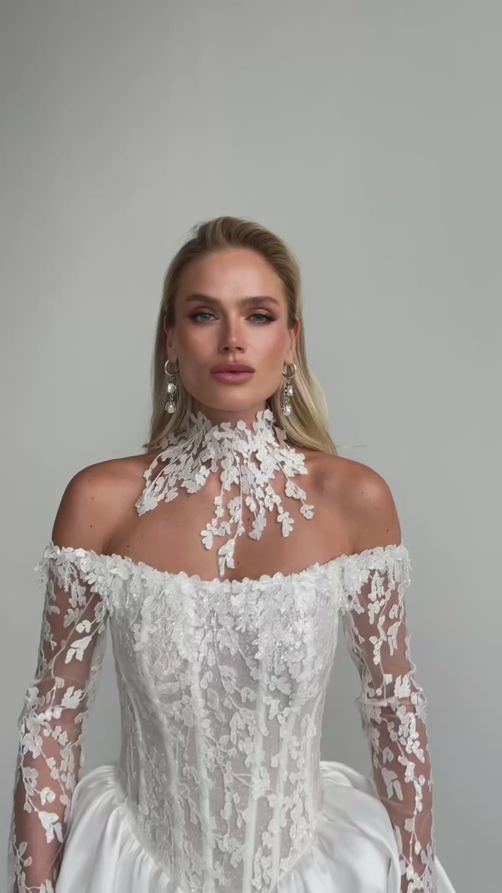 Video: close-up of an off-shoulder lace corset with a floral lace choker collar