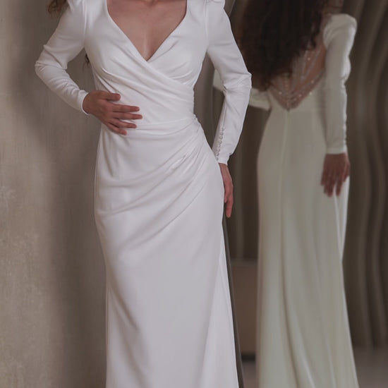 Minimalist crepe wedding dress with long sleeves and V-neckline