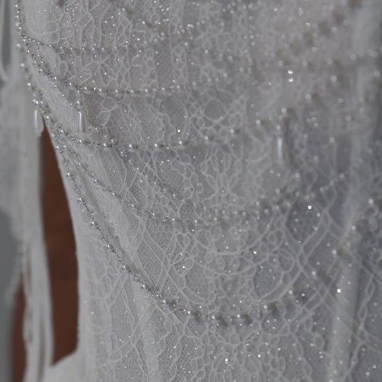 Taffeta wedding dress with lace corset, high-slit overskirt and beaded fringe straps – video
