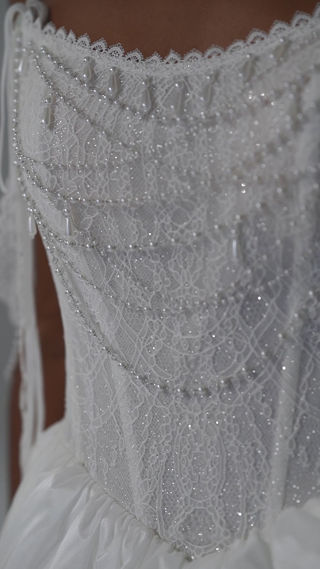 Taffeta wedding dress with lace corset, high-slit overskirt and beaded fringe straps – video