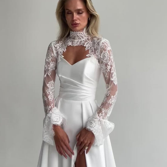 Video: close-up of a sweetheart satin bodice with a lace high-collar bolero and flared lace cuffs