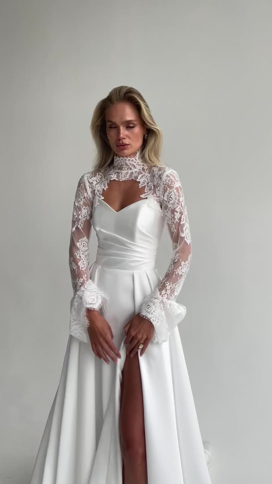 Video: close-up of a sweetheart satin bodice with a lace high-collar bolero and flared lace cuffs