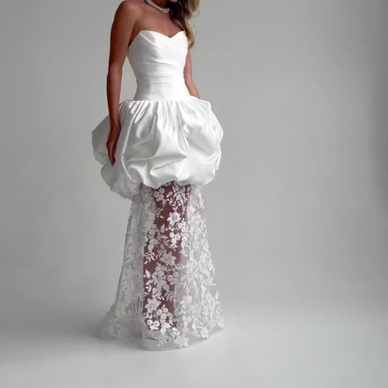 Video: full-length satin and lace wedding dress with a bubble-hem peplum