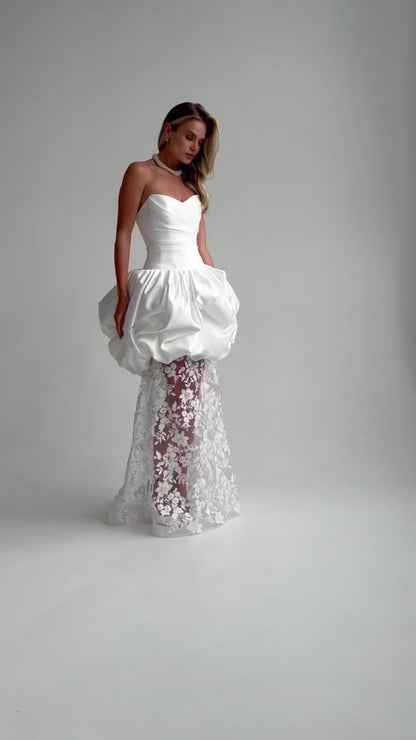 Video: full-length satin and lace wedding dress with a bubble-hem peplum
