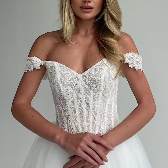 Video: close-up of a beaded lace corset bodice with lace cap straps