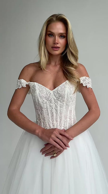 Video: close-up of a beaded lace corset bodice with lace cap straps