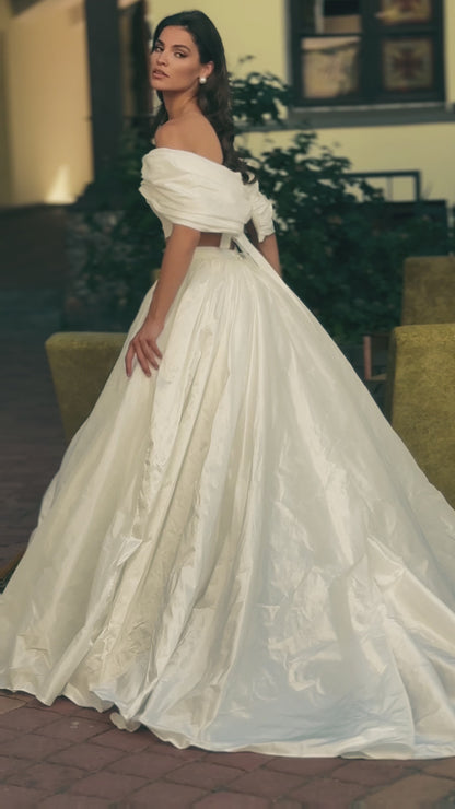 Two-piece A-line wedding dress with off-the-shoulder top.