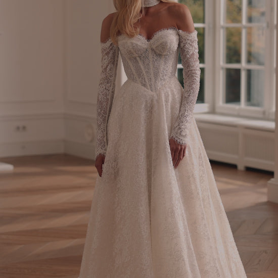 beaded lace bridal gown with corset bodice and sleeves