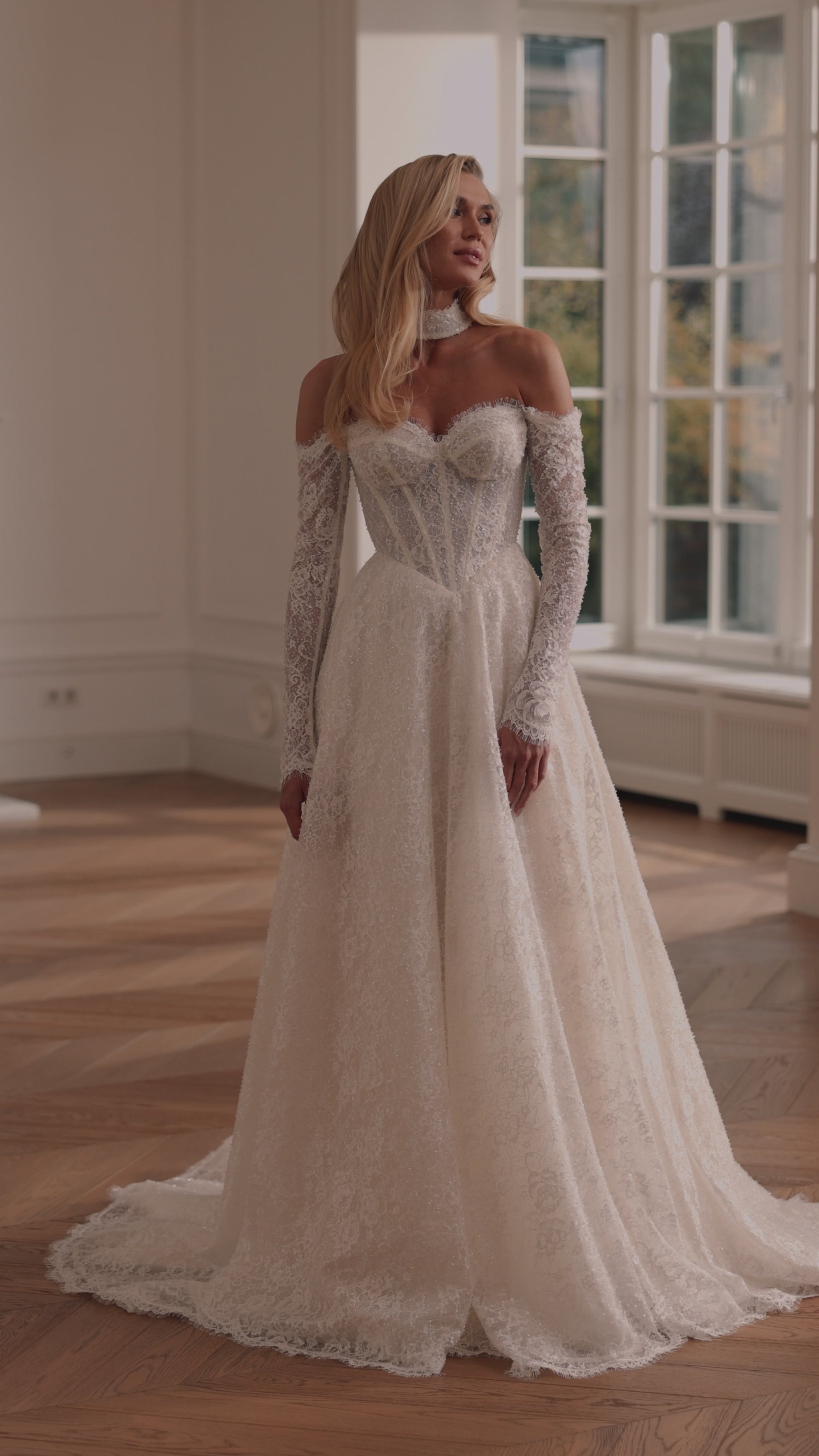 beaded lace bridal gown with corset bodice and sleeves