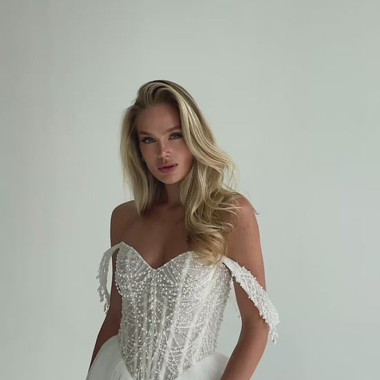 Video: beaded pearl corset with draped off-shoulder straps