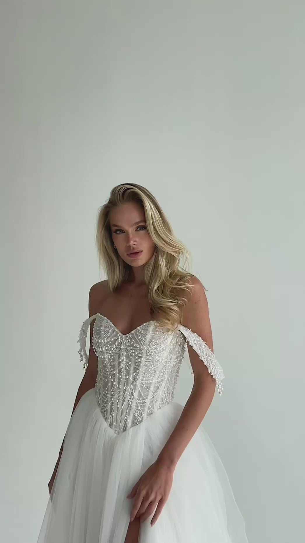 Video: beaded pearl corset with draped off-shoulder straps