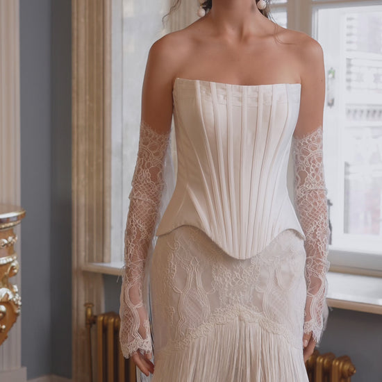 Fitted strapless mikado corset wedding dress with fringe skirt and lace sleeves – video