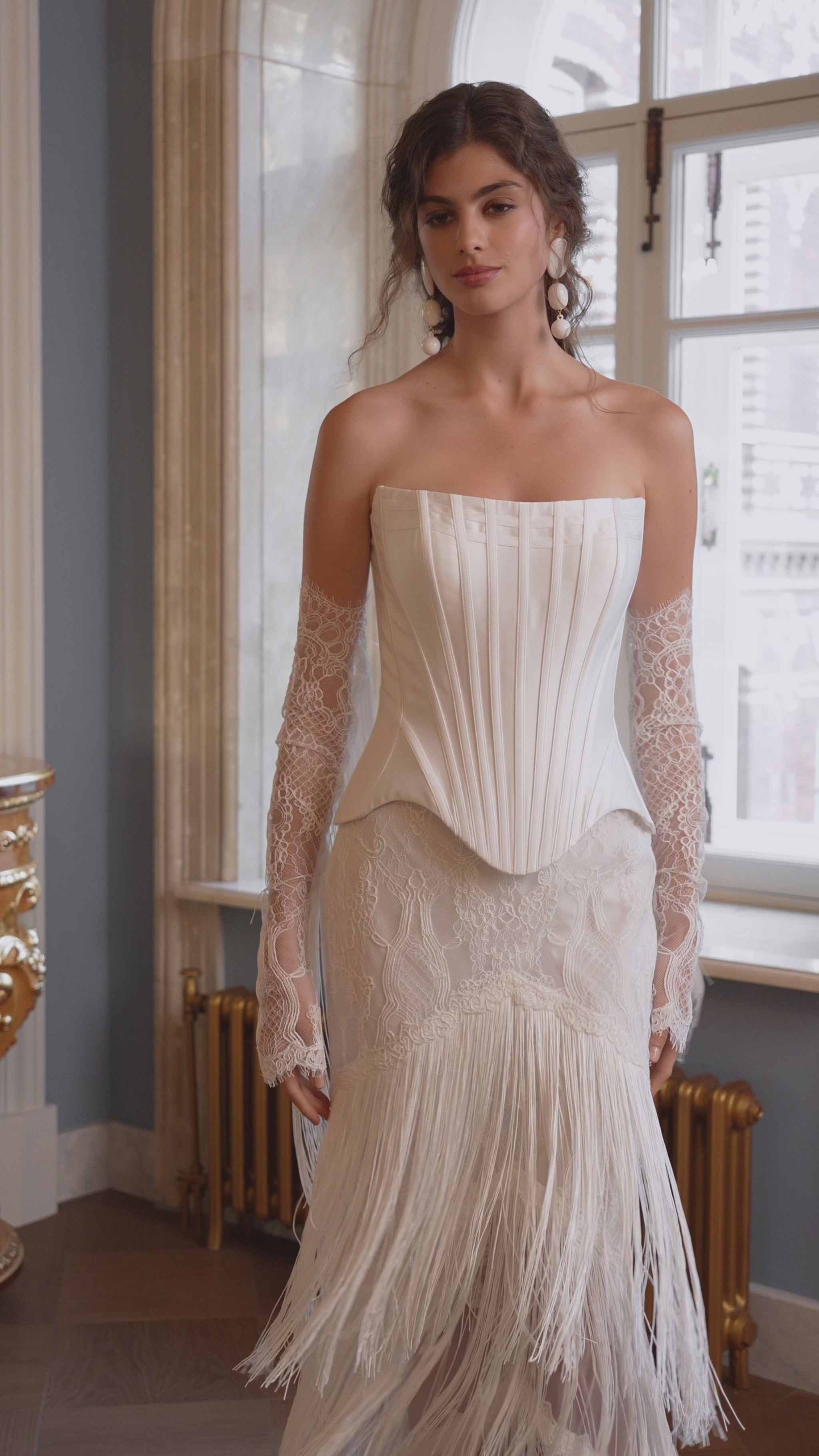 Fitted strapless mikado corset wedding dress with fringe skirt and lace sleeves – video