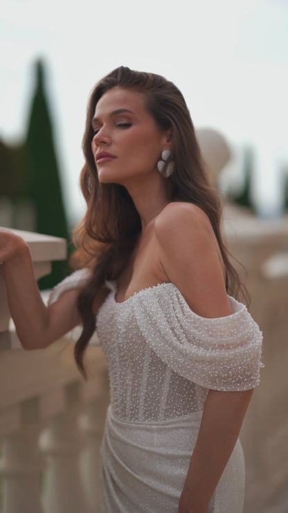 Glitter sheath wedding dress with sequin bodice and train.